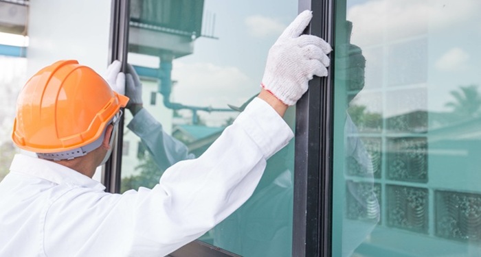 Man fitting windows