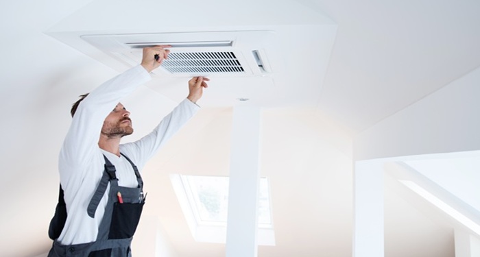 man fitting aircon