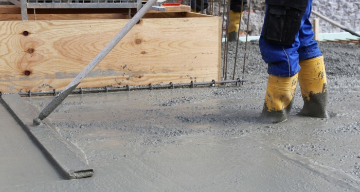 man smoothing concrete